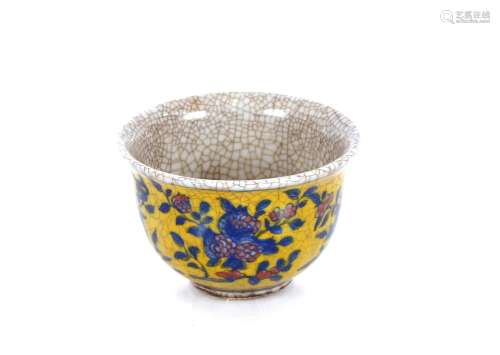 A Chinese crackle glaze yellow ground tea bowl, floral decor...