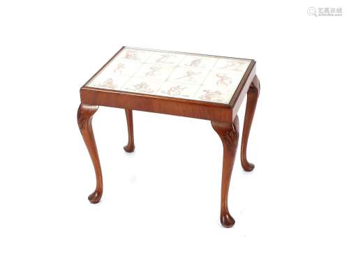 A walnut framed cabriole legged coffee table, the top inset ...