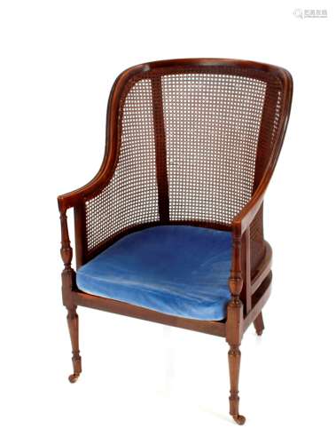 A late 19th Century mahogany framed Bergere armchair, raised...