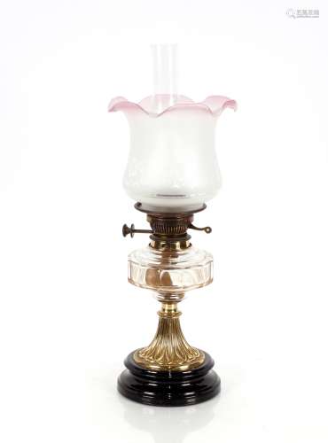 A Victorian oil lamp, having brass column, clear glass reser...