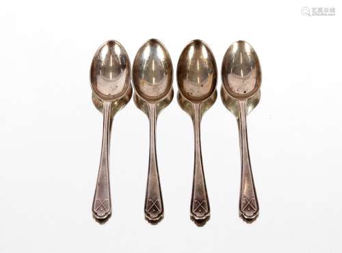 A set of four George V silver teaspoons, with crossed golf c...