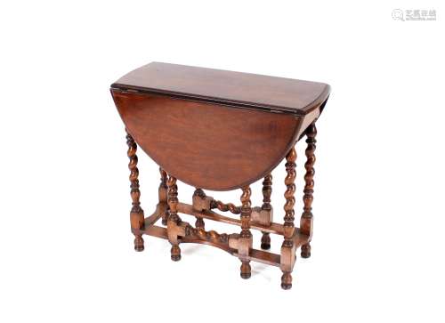 A walnut and cross banded drop leaf occasional table, of sma...