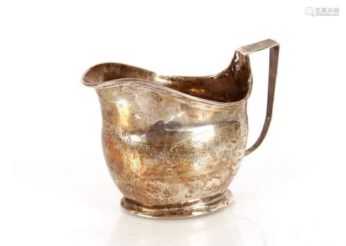A Georgian silver cream jug, having foliate decoration and v...