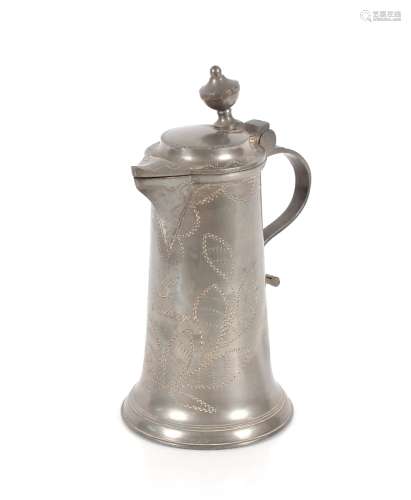 A pewter flagon with wriggle work decoration, inscribed 