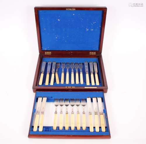 A mahogany cased set of twelve fish forks and eleven fish kn...