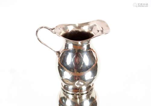 A small George V silver baluster cream jug, of pla