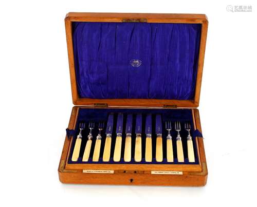 A cased set of twelve silver bladed fruit knives a