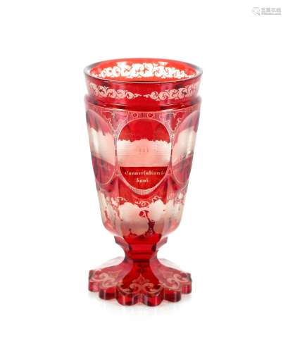 A Bohemian ruby glass goblet, the thumb press panels decorat...