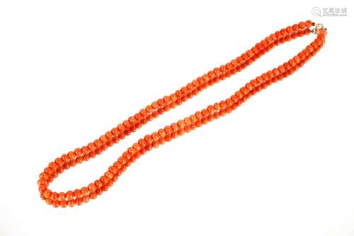 A fine coral bead necklace, with gold clasp
