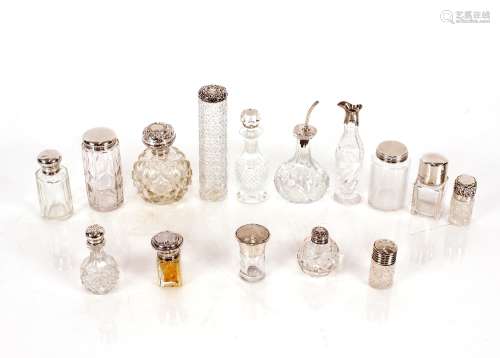 A collection of various cut glass and silver mounted scent b...