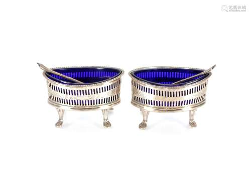 A pair of late Victorian silver oval salts, with blue glass ...