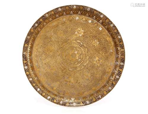 An Eastern brass and white metal inlaid tray, having foliate...