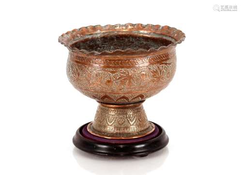 An Eastern copper bowl, with foliate engraved decoration on ...