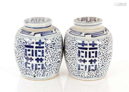 A pair of Chinese blue and white jars and covers, having dec...