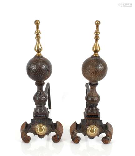A pair of antique cast iron and brass mounted fire dogs, of ...