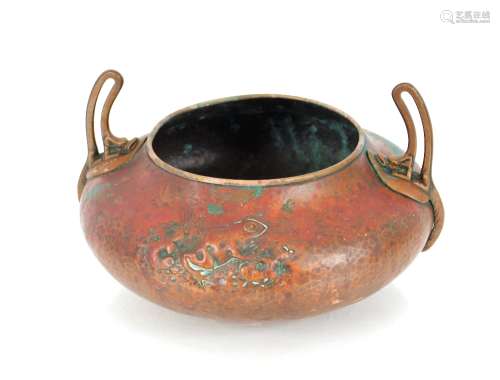 A WMF copper bowl, decorated frogs and flanked by brass loop...