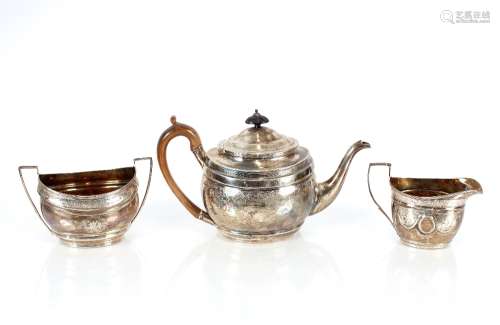 A matched George III silver three piece teaset, different da...