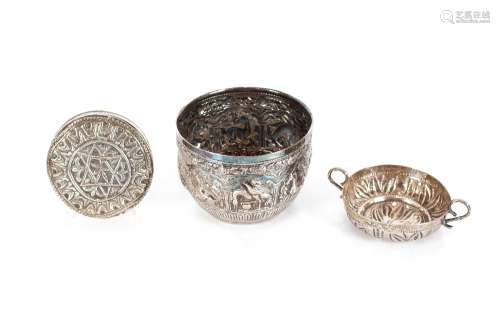 An Eastern white metal bowl, decorated with panels of variou...