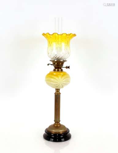 A Victorian oil lamp, with brass Corinthian column and yello...