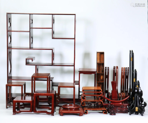12 Chinese Hard Wood Stands; 14 Plate Stands