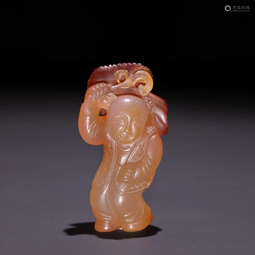 AGATE FIGURE OF BOY HOLDING LOTUS