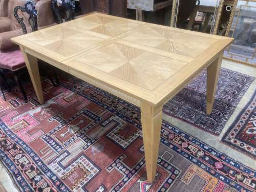 A contemporary inlaid oak extending dining table, 236cm exte...