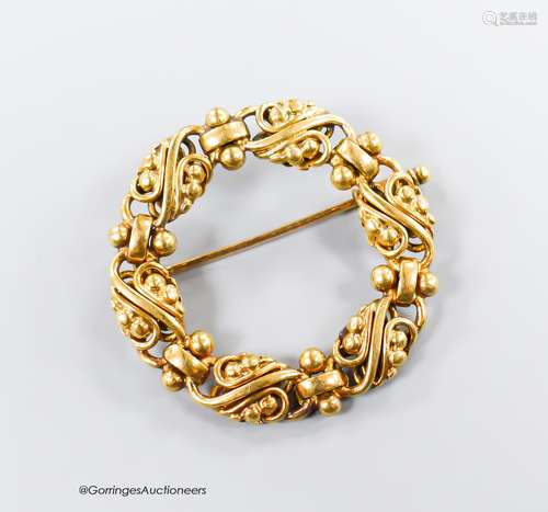 A continental pierced 14k open work circular brooch, maker's...