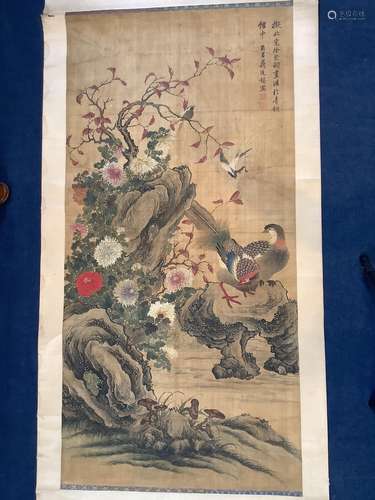 A Chinese scroll painting of birds amid rockwork and chrysan...