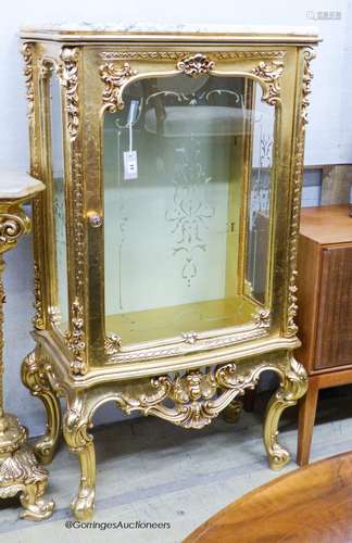 A marble topped gilt vitrine, width 73cm, depth 41cm, height...