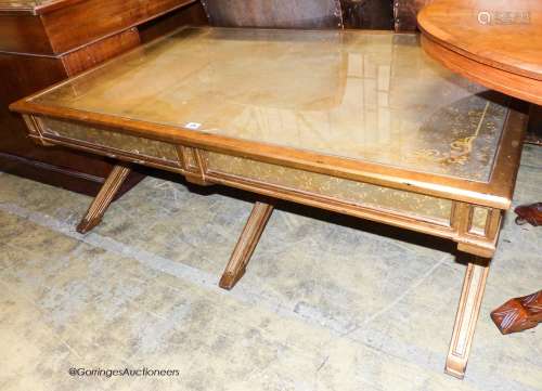 An Italian style gilt and glass 'X' frame coffee table fitte...