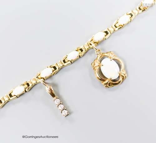 A modern 585 yellow metal and oval white opal set bracelet, ...