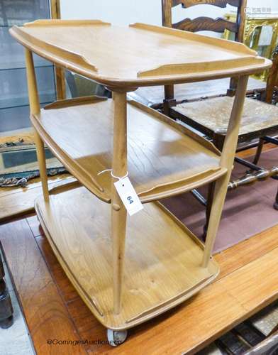 An Ercol light elm and beech three tier trolley, length 72cm...