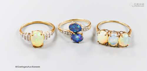 Two modern 9ct gold, opal and diamond set dress rings, size ...