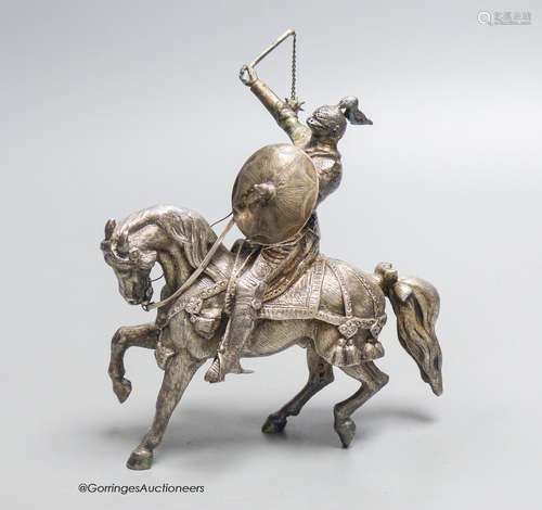 A modern free standing cast silver model of a Knight on hors...