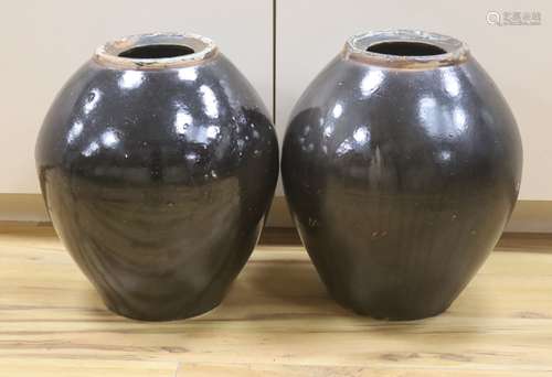 A pair of large monochrome brown glazed jars, height 40cm