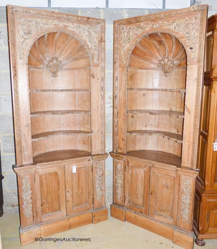 A pair of George III style carved stripped pine niche barrel...