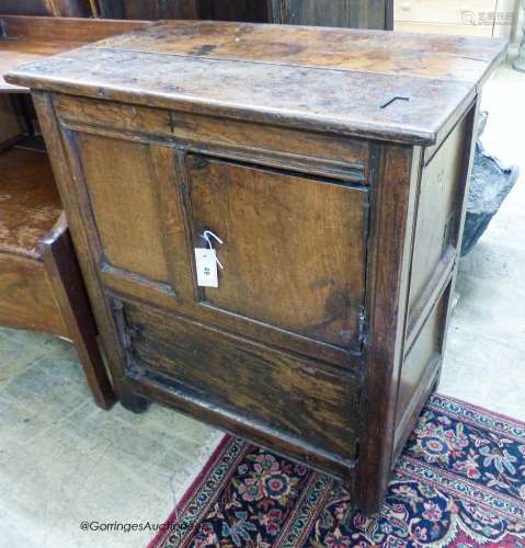 A 17th century oak low cupboard of rectangular form,fitted t...