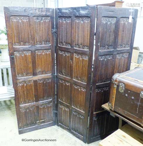 An oak three-fold screen incorporating twenty-four 16th / 17...