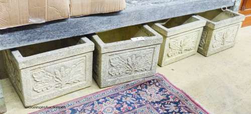 A set of four garden planters moulded with oak leaves and ac...