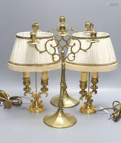 A pair of 19th century brass three branch candlesticks and a...