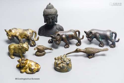 A group of nine Chinese and Oriental bronze figures to inclu...