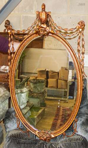 An oval Victorian style gilt wall mirror, width 70cm, height...