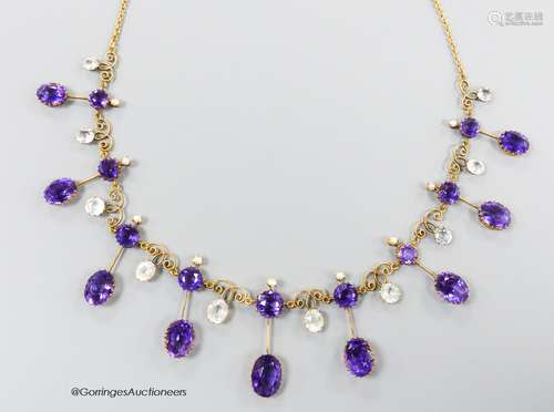 An early 20th century yellow metal, amethyst, aquamarine and...