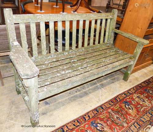 A weathered teak garden bench, length 160cm, depth 56cm, hei...