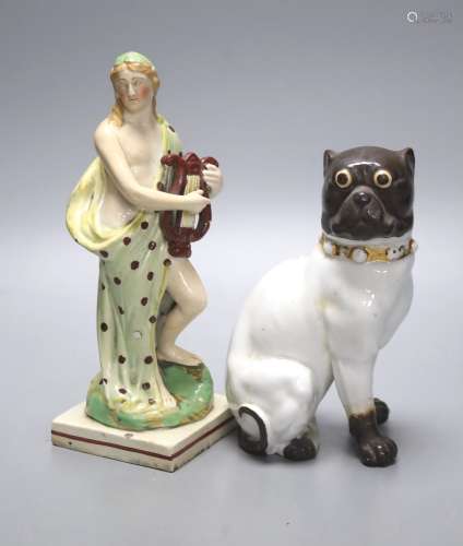 A pearlware figure of a lady, c.1800, with a harp together w...