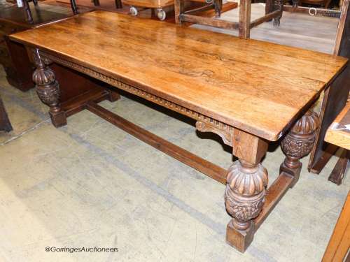 An Elizabethan style rectangular oak refectory dining table,...