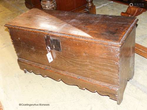 A late 17th / early 18th century small oak six-plank coffer,...