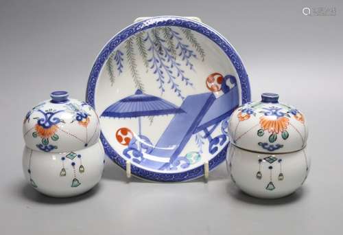 A pair of Japanese Nabeshima style jars and covers and a sim...