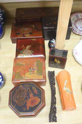 A group of Chinese or Japanese lacquer boxes and a wood stan...