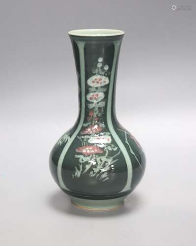 A green Japanese artisan studio vase decorated with flower d...